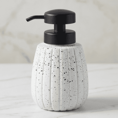 موزع صابون سيراميك بتصميم مضلع ونقاط سوداء.& Speckled Ceramic Soap Dispenser with Ribbed Design.