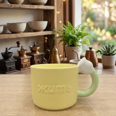 كوب سيراميك أصفر بتصميم "أذني القطة" على المقبض.&  Yellow Ceramic Mug with Cat Ear Handle.