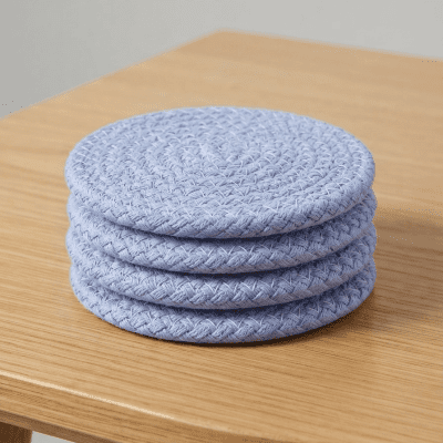 : طقم قواعد أكواب دائرية منسوجة باللون الأزرق الفاتح (4 قطع)  & : Set of 4 Woven Round Coasters in Light Blue