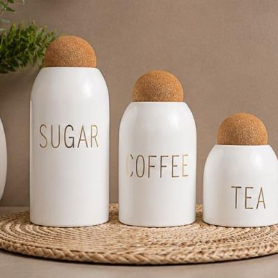 Modern glass jar set with elegant white finish and natural cork lids. Perfect for storing sugar, coffee, and tea while adding a stylish and organized touch to your kitchen decor