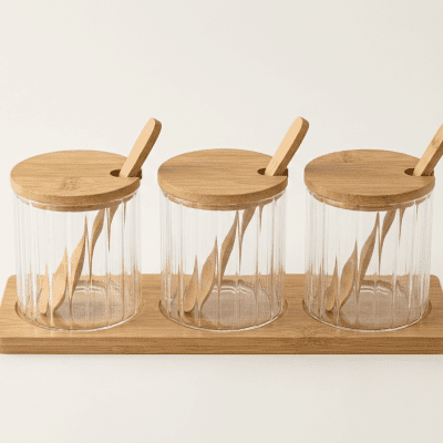 مانات توابل زجاج مضلع 3 قطع بغطاء وحامل خشب  3-Piece Ribbed Glass Spice Jar Set with Bamboo Lids and Tray.