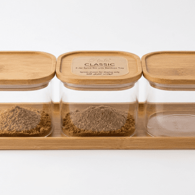 طقم علب تخزين وتوابل زجاجية مستطيلة بغطاء وقاعدة خشب بامبو (3 قطع).3-Piece Rectangular Glass Storage and Spice Jar Set with Bamboo Lids and  
