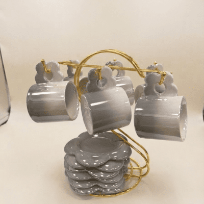 : طقم أكواب قهوة (أو شاي) مع أطباق وحامل ذهبي بتصميم زهرة.  & Ceramic Flower-Shaped Coffee Cup & Saucer Set with Gold Stand.