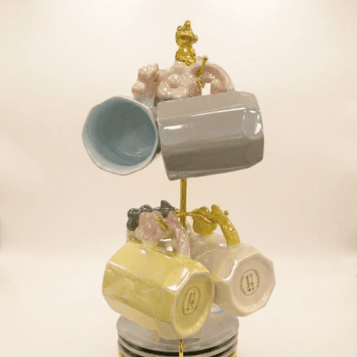 طقم أكواب قهوة ملونة بتصميم زهور مع حامل ذهبي.  & Pastel Ceramic Floral Coffee Cup & Saucer Set with Gold Stand.
