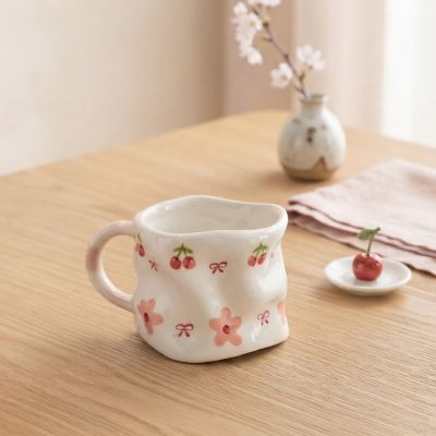 كوب سيراميك يدوي الصنع بنقشة الكرز، الفيونكات والزهور الوردية.  & : Handmade Ceramic Cherry, Bow, and Pink Floral Mug.