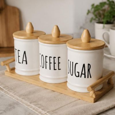 Ceramic Tea, Coffee & Sugar Canister Set Keep your kitchen neat and stylish with this elegant ceramic storage set. Comes with bamboo lids and a matching tray &mdash; perfect for storing tea, coffee, sugar, and more.