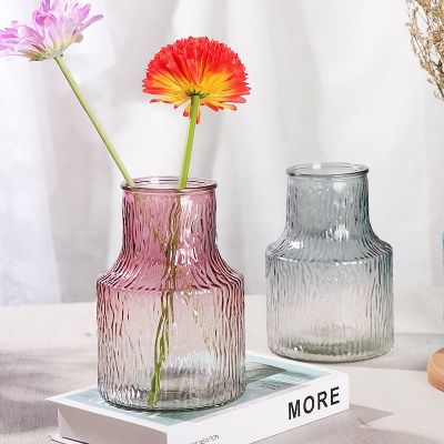 Nordic Ripple-Textured Glass Vase Set Infuse your home with a subtle touch of color and timeless Scandinavian charm with our Ripple-Textured Glass Vases. Featuring a unique tapered shape and a beautifully organic texture, these tinted glass bottles are pe