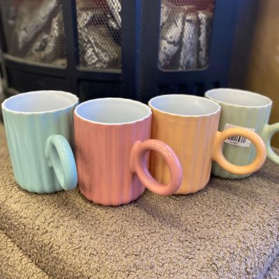  pastel-colored, ribbed ceramic mugs with circular ring handles, often sold as decorative drinkware or "IKEA-style" mugs