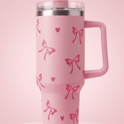 This "Pink Love" travel mug is more than just an accessory&mdash;it's a celebration of life's charming moments. Every feature, from the empowering text at its core to the hand-drawn-style red bows and hearts, is designed to support and inspire y