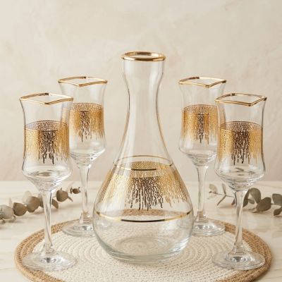 ​"Elevate your dining experience with exquisite gold detailing."