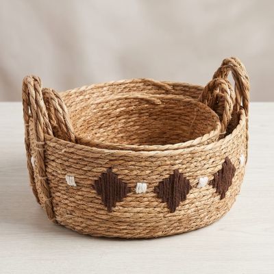 ​"Organize your space in style. Our hand-woven baskets are now available in a set of three sizes."